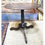 An 18th century country oak tripod table,