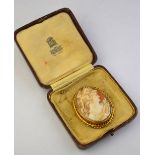 An oval shell cameo of female with lyre,