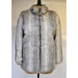 A vintage grey faux fur jacket with neru