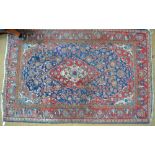 A Persian Kashan rug, large red/ivory lo