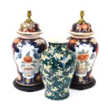 A pair of Imari style vases, mounted for