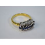 A tanzantite and diamond three-row cluster ring, 18ct yellow and white gold claw setting, size P,