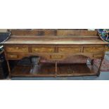 A George III oak low dresser base of Scottish origin,