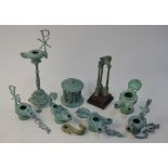 Six various verdigris-patinated bronze reproduction Roman oil lamps to/w a similar miniature ruined