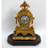 A French gilt metal and porcelain panelled mantel clock with 8-day movement,