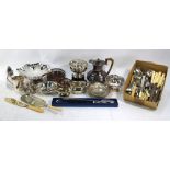 A quantity of electroplated items including a silver-handled bread knife and other flatware,
