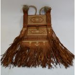 A Moroccan tooled leather saddle bag, two horn-handled knives,