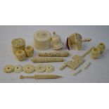 A Cantonese carved ivory part set of sewing accoutrements including pin cushion, thimble-box,