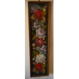 A 1920s framed and glazed wool-worked tapestry of trailing roses, 29 cm wide x 124.