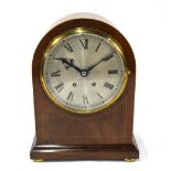 A walnut dome cased 8-day mantel clock, the movement stamped WBK & Fils, Paris with silvered dial,