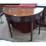 A Victorian mahogany demi-lune fold over tea table,