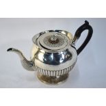 A George III silver half-reeded spherical teapot on flared foot, Robert Hennell I,