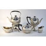 An oval half-reeded silver five-piece tea/coffee service including kettle on stand with burner,
