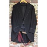 A gentleman's morning suit with quilted lining, braiding to lapels and sleeves,