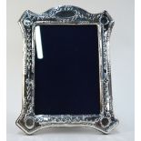 A modern silver-faced photograph frame in the Regency manner,