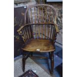 A 19th century elm hoop back Windsor chair,