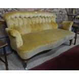 A Victorian walnut and part steel framed button backed open arm sofa of serpentine form,
