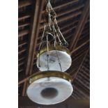 A pair of Art Deco brass ceiling lights with frosted swirling glass bowl shades,