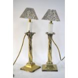 A pair of epns classical column candlesticks,