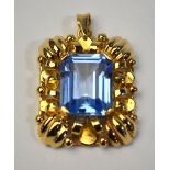 A rectangular blue spinnel set pendant,