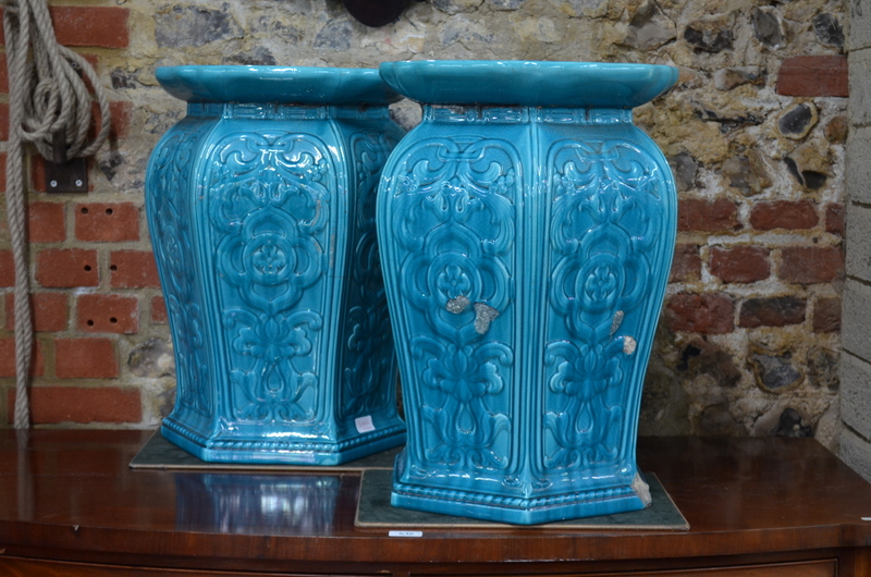 A pair of Minton majolica, turquoise monochrome garden seats, of curved hexagonal form,