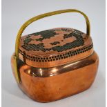 A Chinese copper hand warmer of oval form with looped handle and reticulated cover;