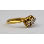 A three stone old cut diamond crossover ring, 18ct yellow gold claw setting, approx 0.