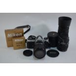 A Nikon FM2 35 mm SLR camera no.8240893, with AF Nikkor 80=200 mm 1:4.5-5.