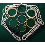 Collection of mother of pearl and other bead necklaces to/w carved resin bangles,
