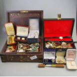 A quantity of vintage jewellery in two jewel boxes including simulated pearls,