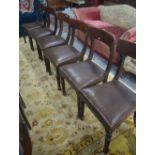A set of seven 19th century bar back side chairs with overstuffed seats raised on turned front legs