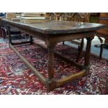 An early part 18th century waxed pine refectory table,