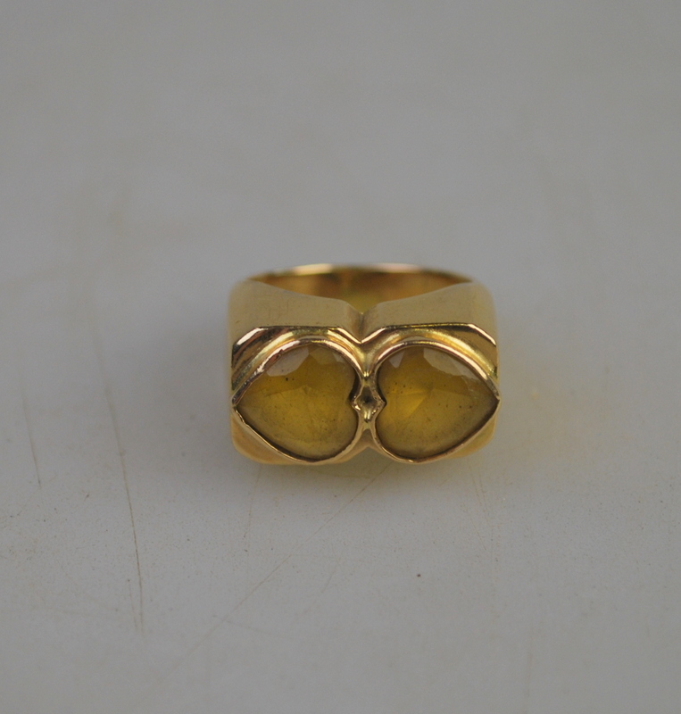 A yellow metal set with two heart shaped citrines, approx 9g all in,