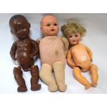 An Armand Marseille 996 A4M doll, a 'Dollies' 3 black doll, another doll with soft body,