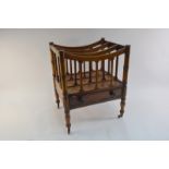 A Victorian mahogany four division Canterbury with drawer beneath,