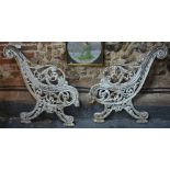 A pair of Coalbrookdale style heavy cast iron bench ends (ends only)