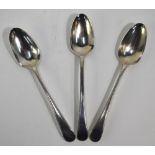 Three matched Georgian feather-edge tablespoons - various makers and dates (rubbed),