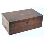 A Victorian brass bound mahogany campaign writing box, hinged to a gilt tooled red leather slope,