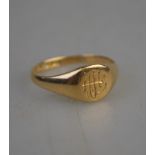 An 18ct yellow gold monogrammed signet ring, size N 1/2,