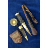 A Skein Dhu with carved wood handle and electroplated mounts, leather sheath,