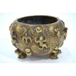 A Chinese metal bowl with tripod frog, or other amphibian,