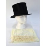 A black silk top hat retailed by Christys', London, 56 cm circ., 20 cm front to back, 16.