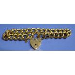 A heavy 9ct gold curb chain bracelet with padlock clasp, 43.
