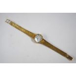 A lady's 9ct gold Rotary wristwatch with electronic movement, on textured flexible bracelet strap,