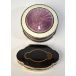 A circular silver pill-box and cover with two-colour basse-taille enamel, Cohen & Charles,