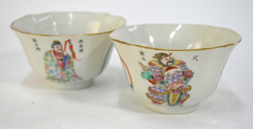 A pair of famille rose bowls each one decorated with Heroes from the The Wu Shuang Pu compiled by