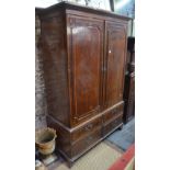 A Regency satinwood banded mahogany linen cupboard,