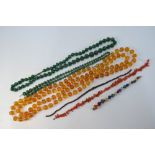 A collection of bead necklaces and loose beads including long row of copal and rice pearl beads on