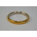 A platinum wedding band with gold overlay, size Q, approx 4.