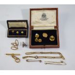 Various gold items including double stick pin interlinked by fine chain, four dress studs, tie pin,